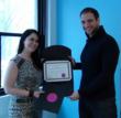Certified F.A.B.U.L.O.U.S. Site Director Jessica Jacques presenting "Certified F.A.B.U.L.O.U.S. Seal of Approval" to Joshua Gordon, Founder and CEO of NOYA